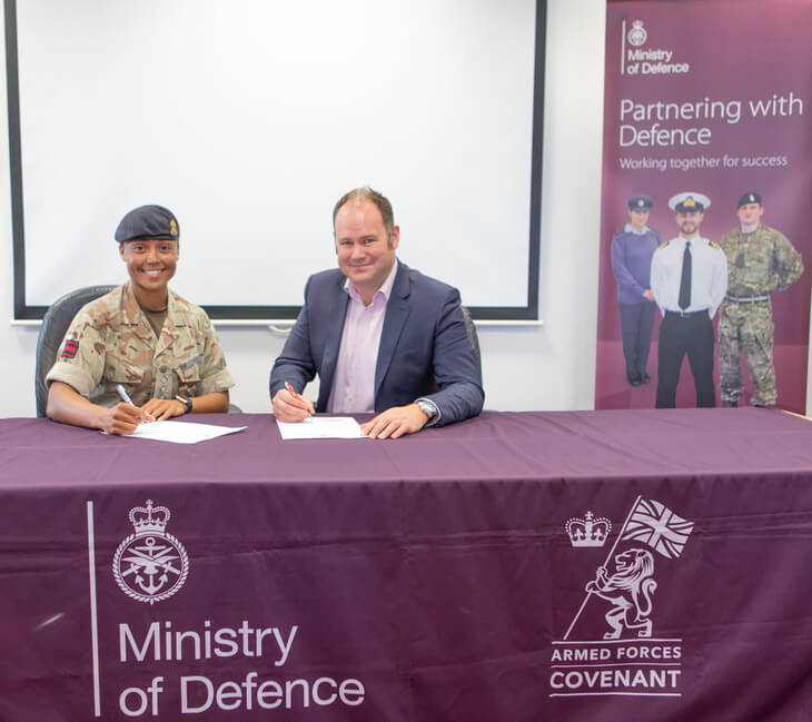 Bradley Post. MD of RIFT Tax Refunds, signs the Armed Forces Covenant